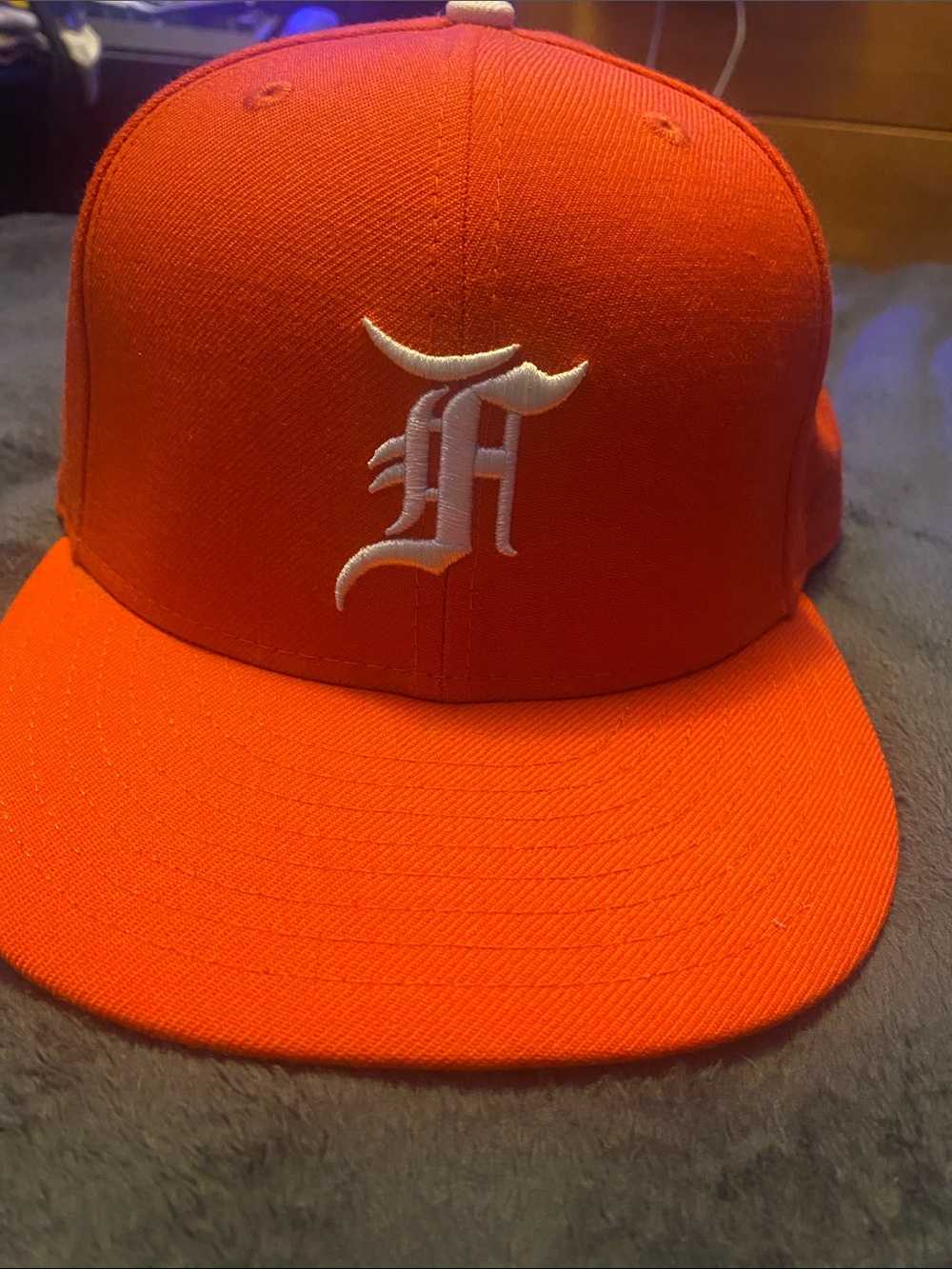 Orange Flat-Brim ‘Fear Of God’ Hat with White Embroidered ‘F’ logo